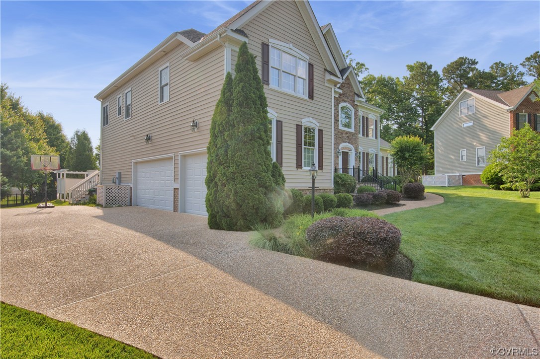 6418 Rivershook Terrace Moseley, VA 23120 - Photo 6 of 44 a front view of a house with garden