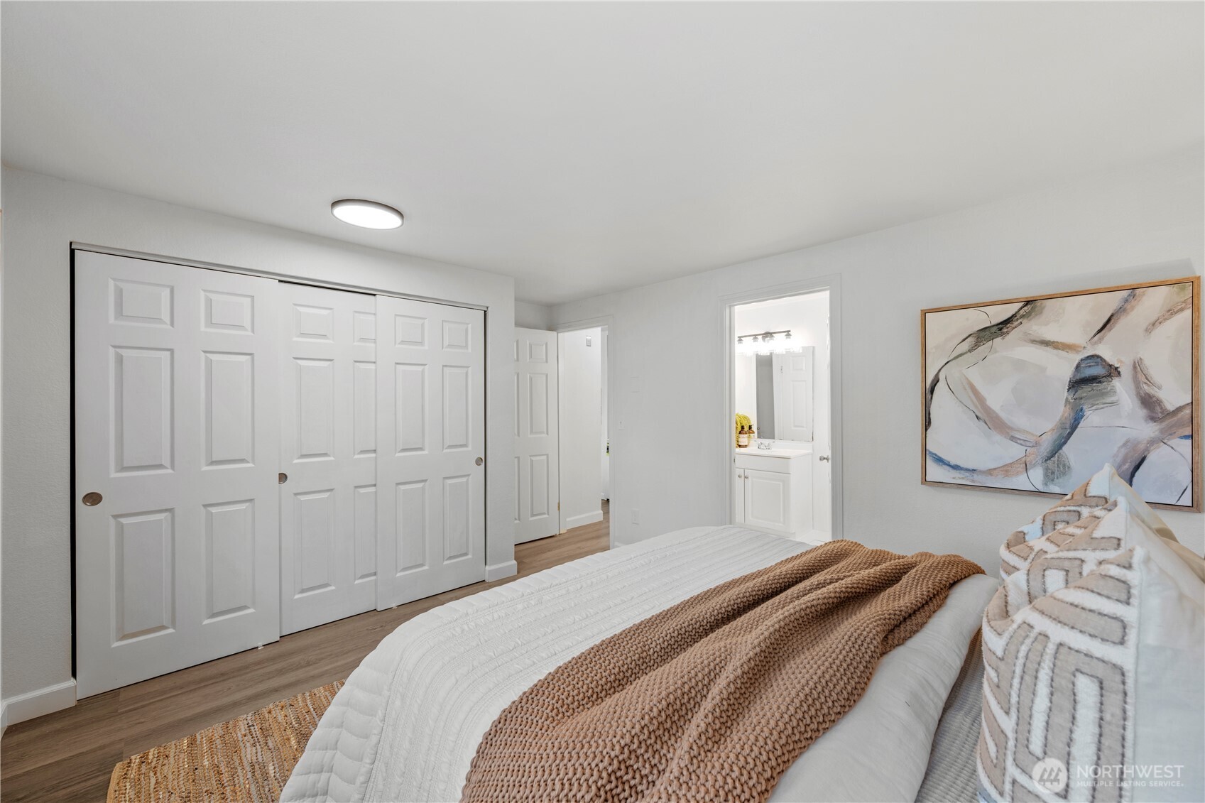 707 North 130th Street, Unit B204 Seattle, WA 98133 - Photo 14 of 21 a bedroom with a bed and a window