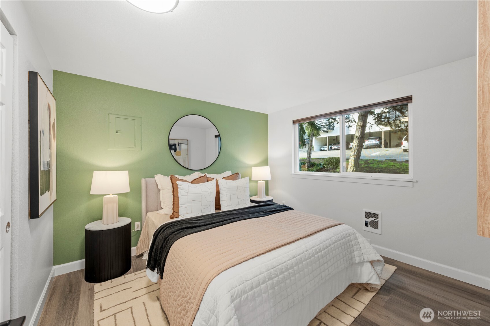 707 North 130th Street, Unit B204 Seattle, WA 98133 - Photo 15 of 21 a bed room with a bed mirror and a window