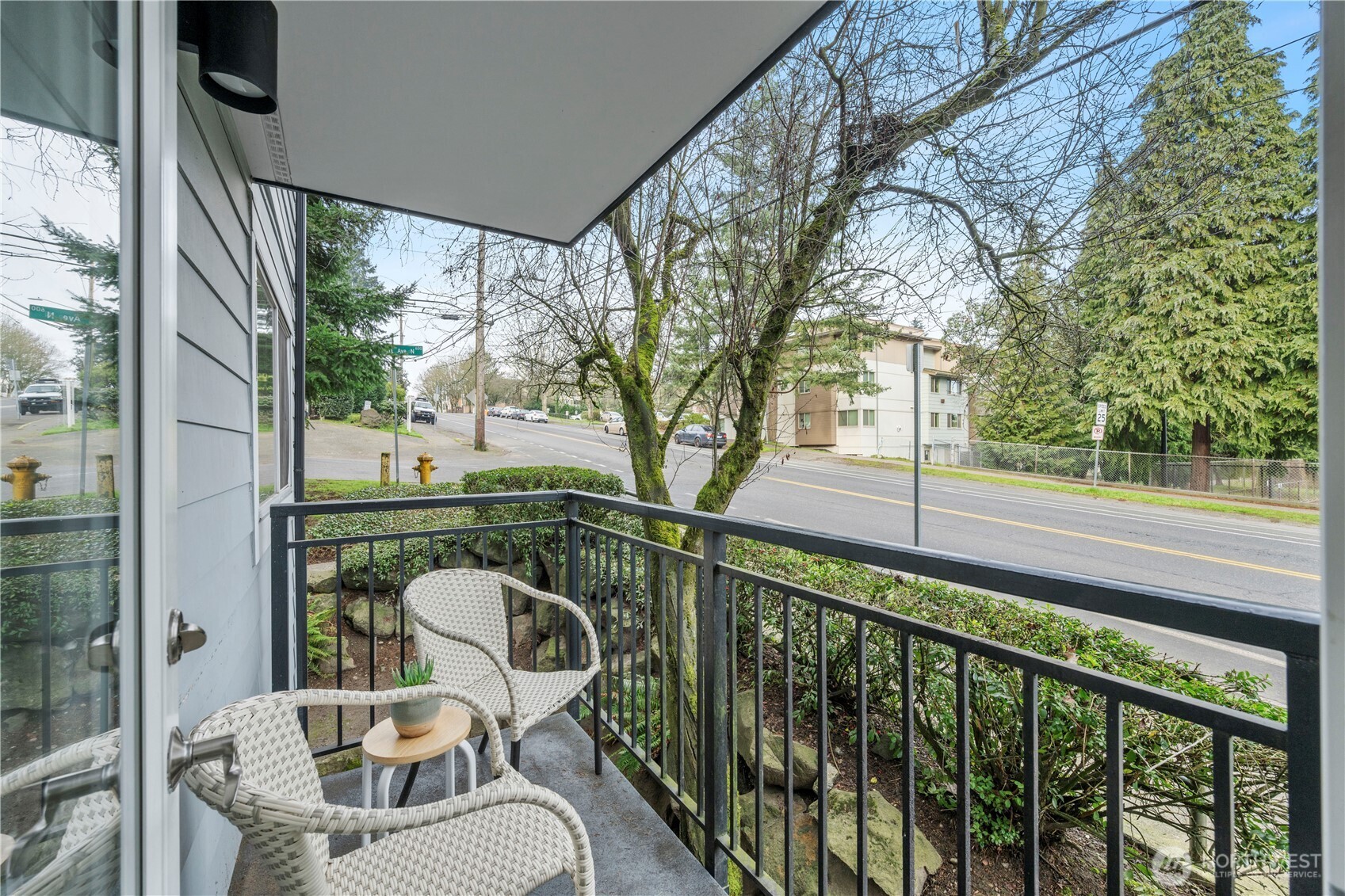 707 North 130th Street, Unit B204 Seattle, WA 98133 - Photo 17 of 21 a view of a chair and tables in the balcony