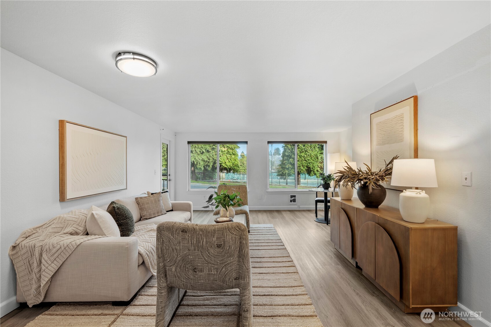707 North 130th Street, Unit B204 Seattle, WA 98133 - Photo 3 of 21 a living room with furniture and a large window
