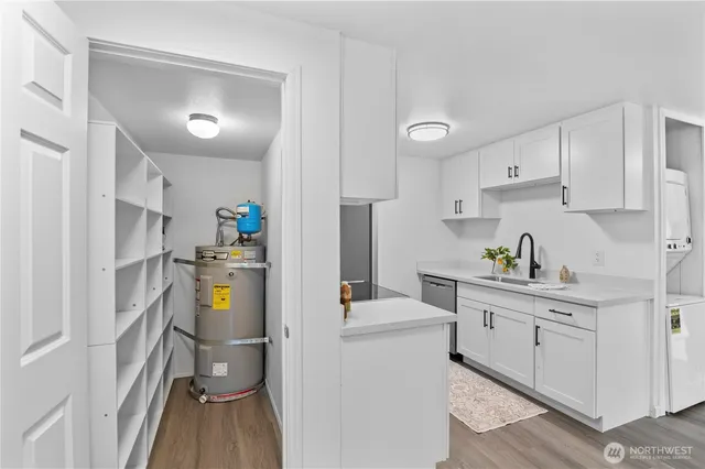 a kitchen with cabinets and appliances