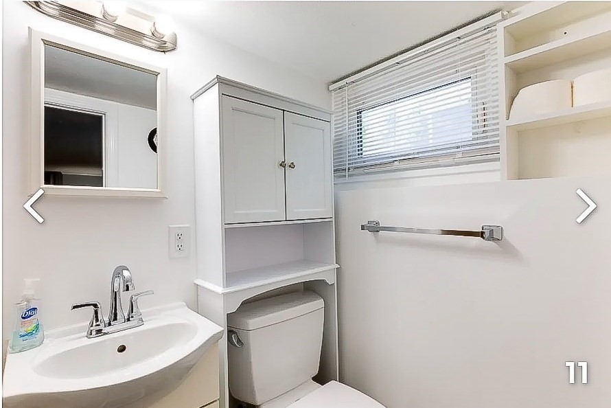 8 Franklin Street, Unit 19 Marblehead, MA 01945 - Photo 5 of 6 a bathroom with a sink a toilet and a mirror