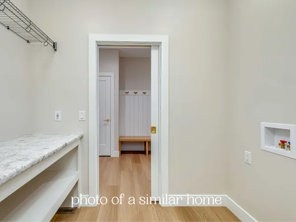 a view of hallway with washer and dryer