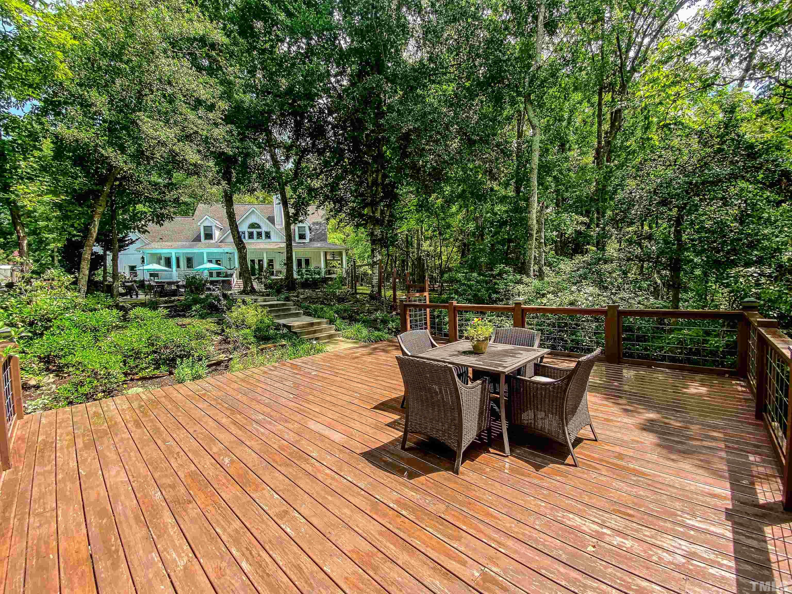 303 Bowen Road Rougemont, NC 27572 - Photo 16 of 85 a view of a patio with table and chairs wooden floor and fence