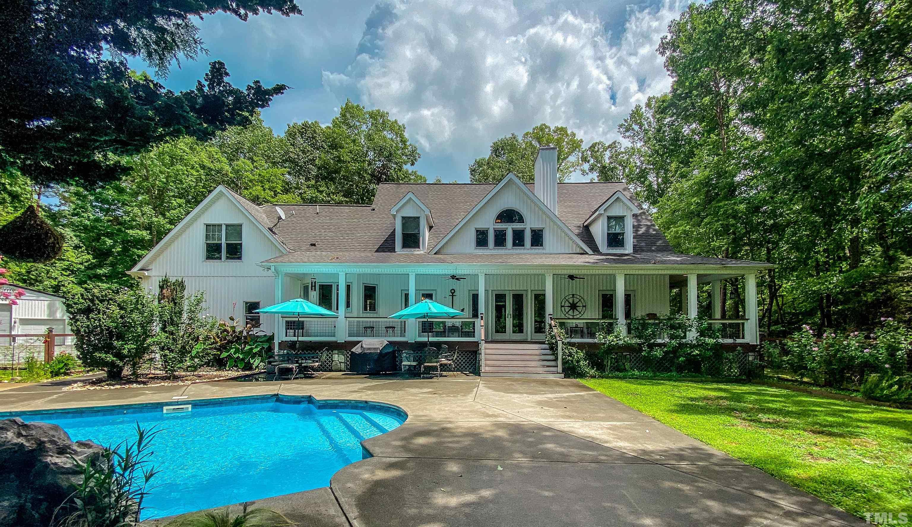 303 Bowen Road Rougemont, NC 27572 - Photo 35 of 85 a front view of a house with swimming pool and porch