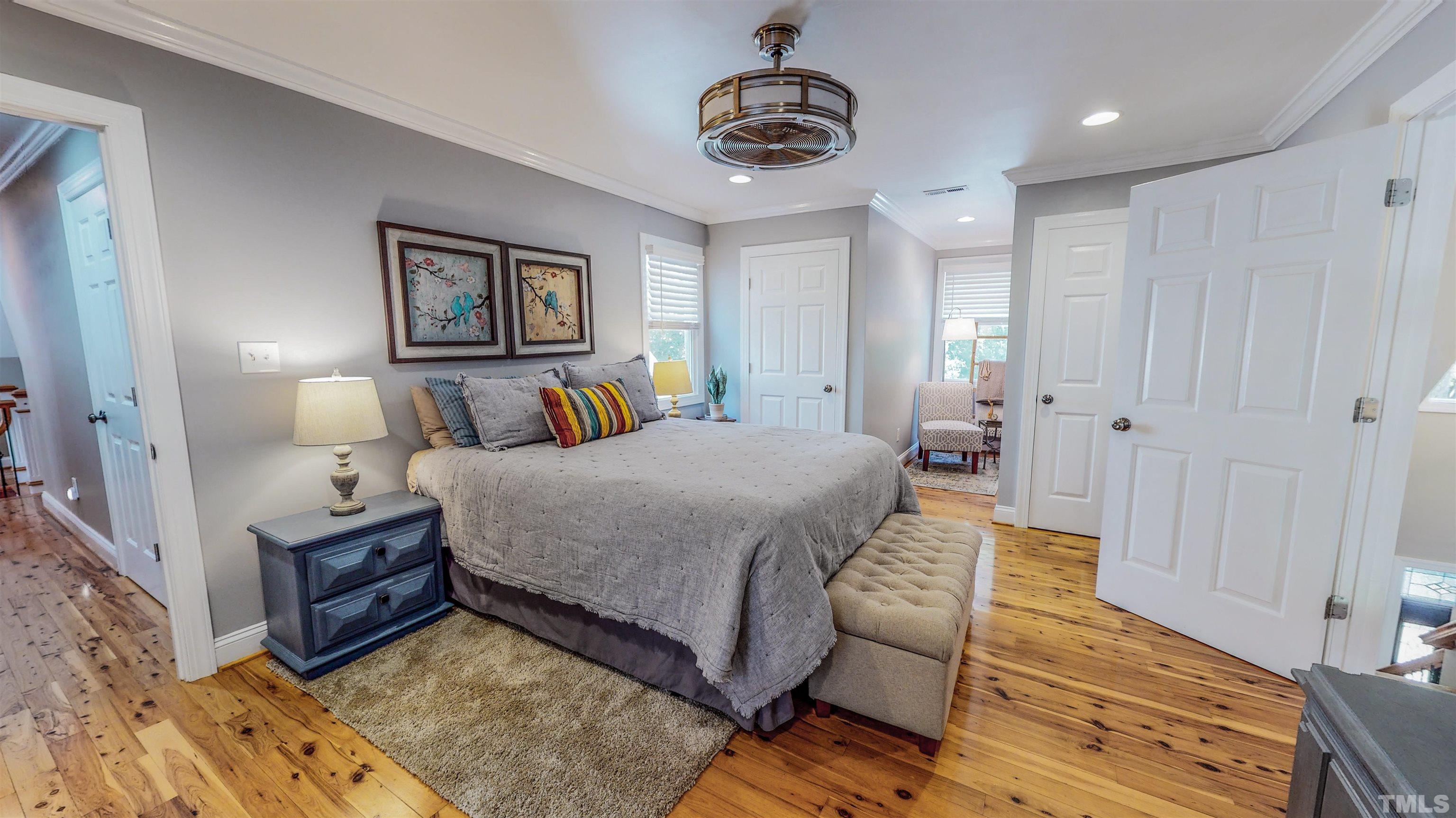 303 Bowen Road Rougemont, NC 27572 - Photo 50 of 85 a bedroom with a bed and a chandelier