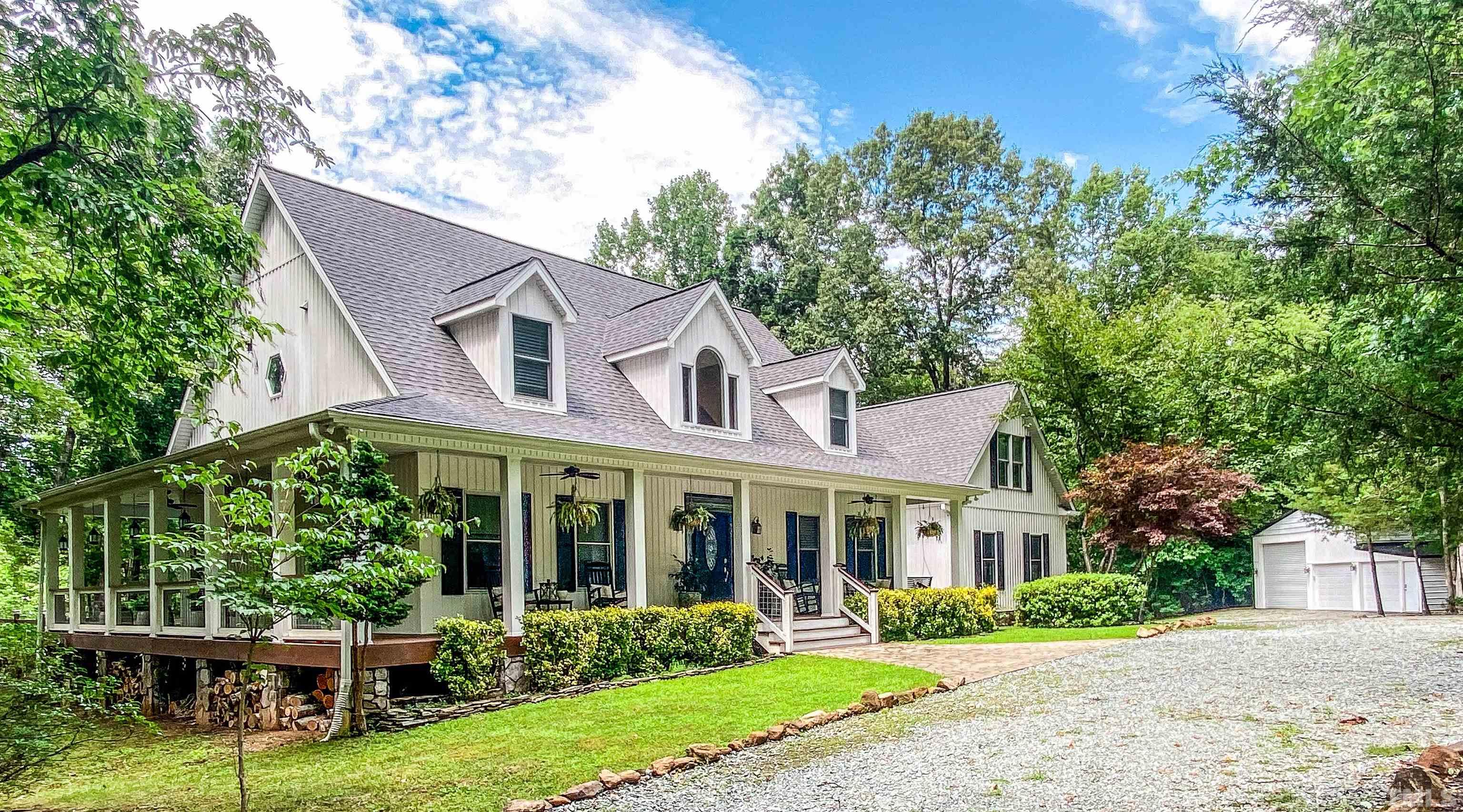 303 Bowen Road Rougemont, NC 27572 - Photo 67 of 85 a view of a house with a yard and potted plants