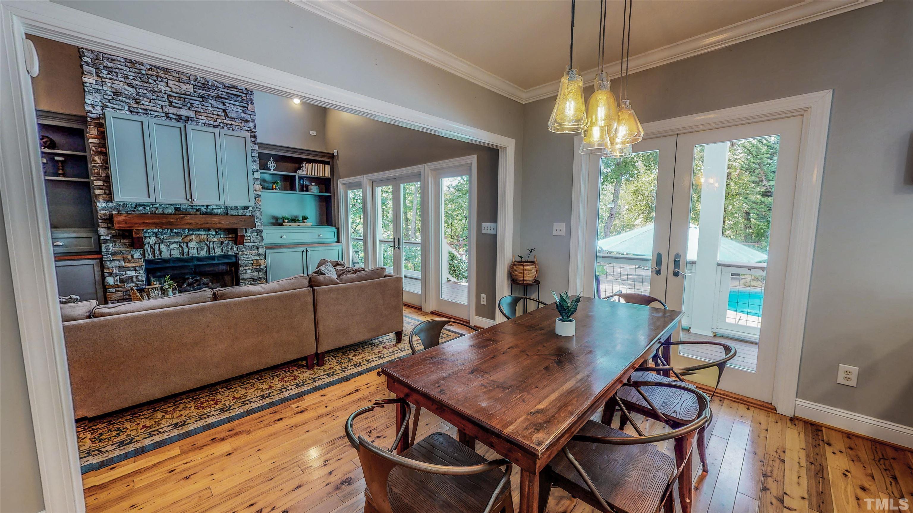 303 Bowen Road Rougemont, NC 27572 - Photo 72 of 85 a living room with furniture a flat screen tv and a large window