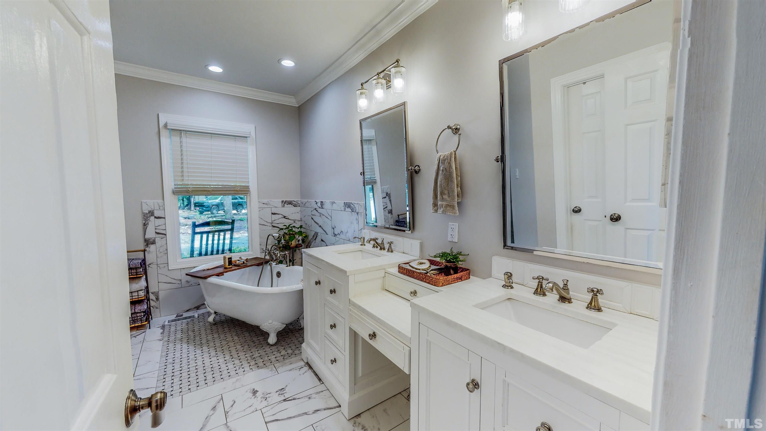 303 Bowen Road Rougemont, NC 27572 - Photo 8 of 85 a bathroom with a sink double vanity and a mirror