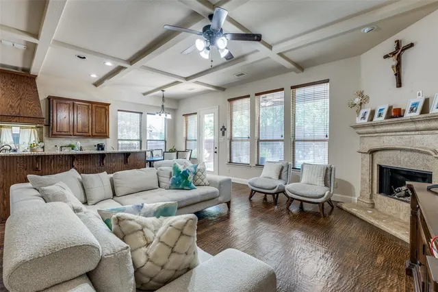 a living room with furniture fireplace and flat screen tv