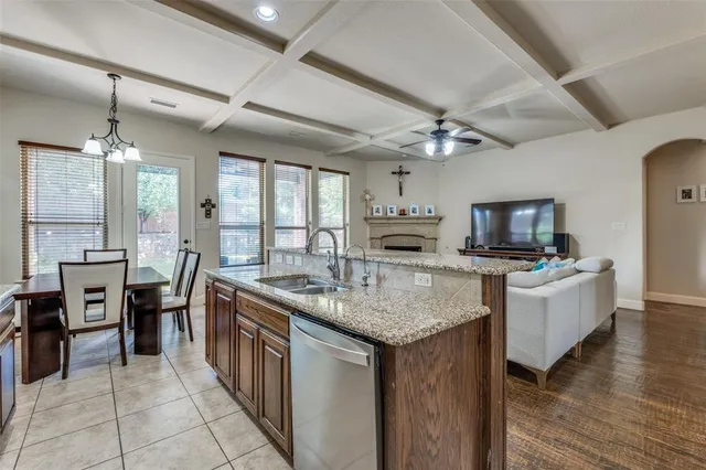 a kitchen with stainless steel appliances granite countertop a stove and a refrigerator