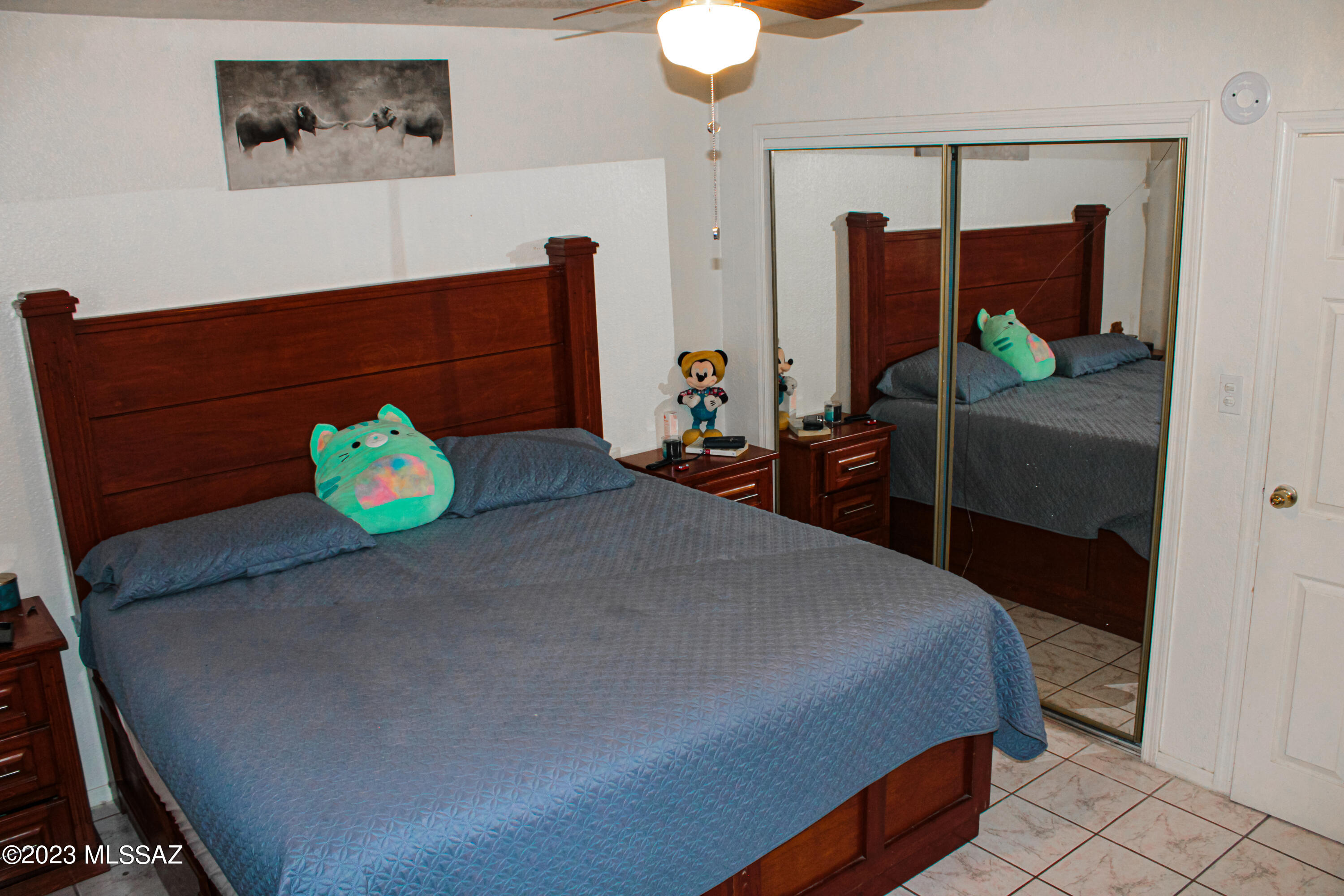 282 Paseo Mascota Rio Rico, AZ 85648 - Photo 16 of 18 a bedroom with a bed and dresser