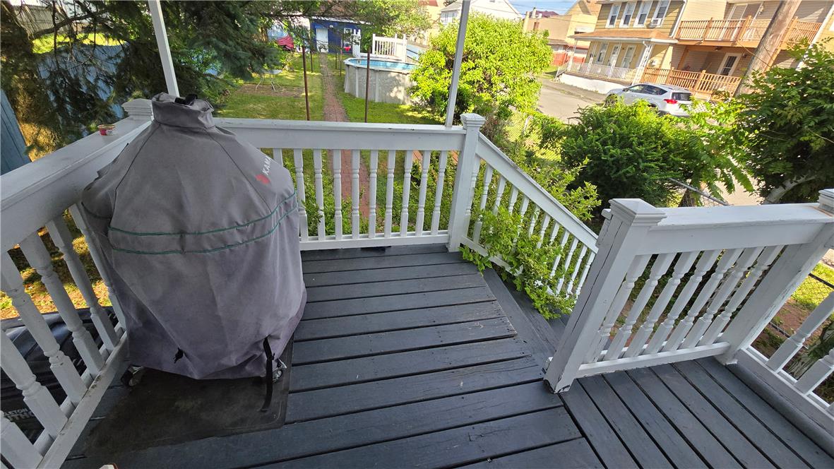 883 North Locust Street Hazleton, PA 18201 - Photo 23 of 83 An inviting deck offers outdoor living space with easy access to the yard and an above-ground pool.