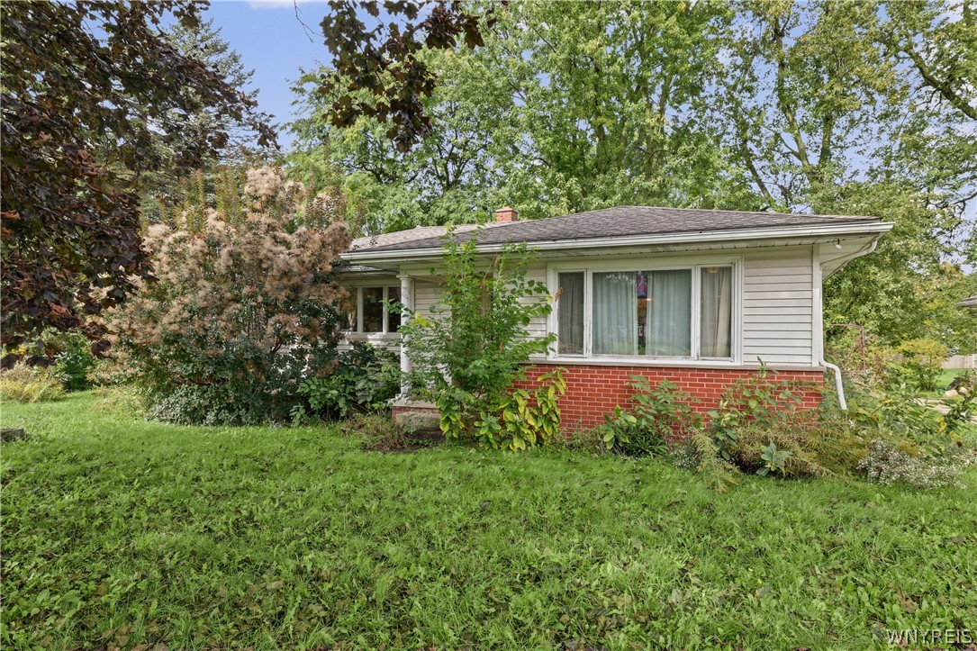 8435 Rochester Road Royalton, NY 14067 - Photo 2 of 27 Mature trees surround this classic ranch home feat
