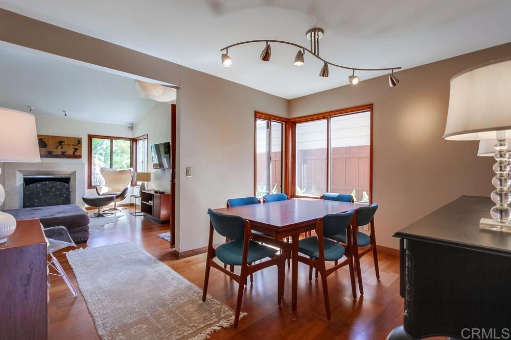 428 Compass Road Oceanside, CA 92054 - Photo 7 of 21 a view of a a dining room with furniture window and wooden floor