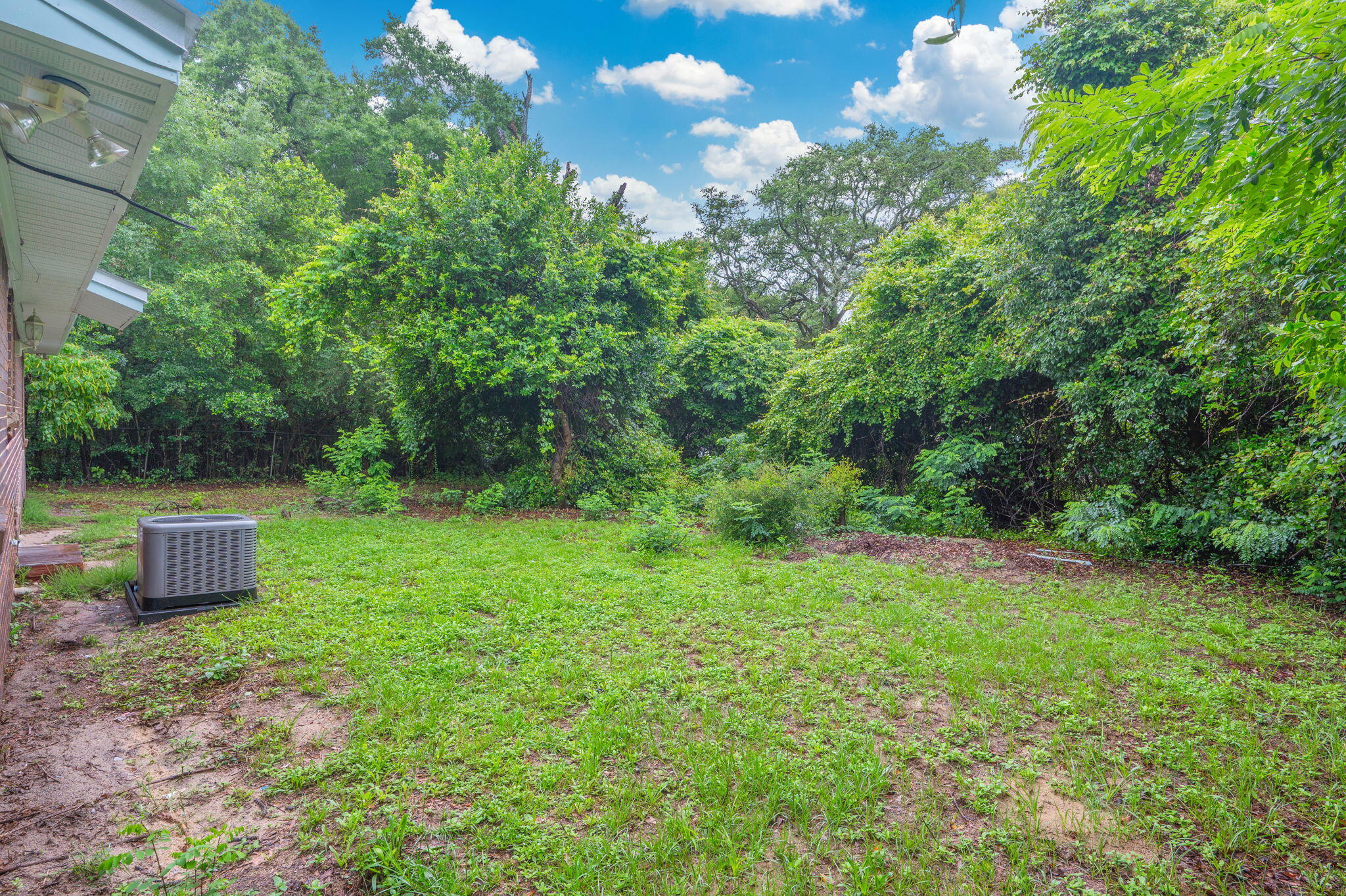 834 McDonald Street Crestview, FL 32536 - Photo 29 of 35 a view of a garden with a tree