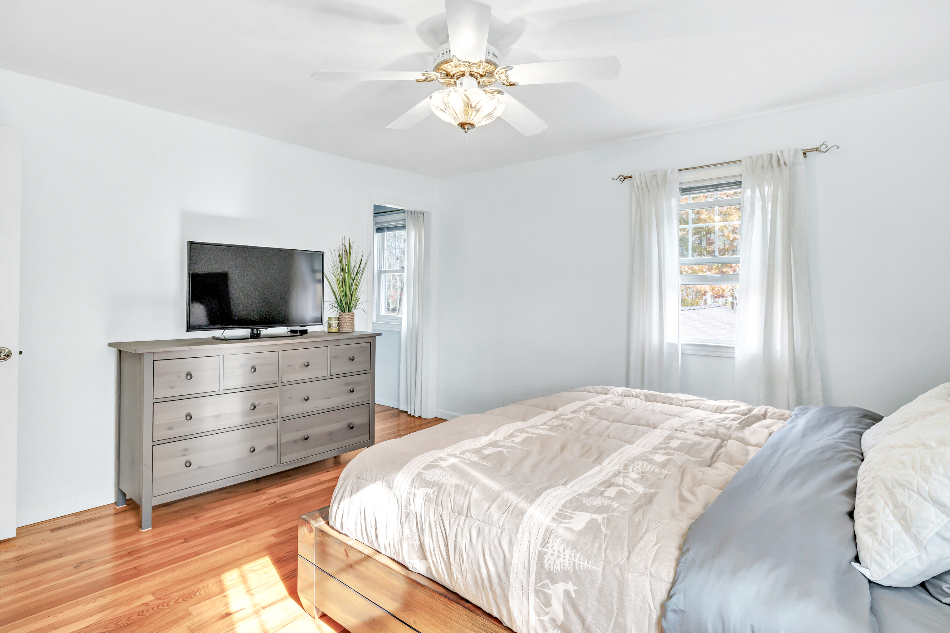 91 Harvester Road Monroe, CT 06468 - Photo 13 of 35 a bedroom with a bed and a flat screen tv