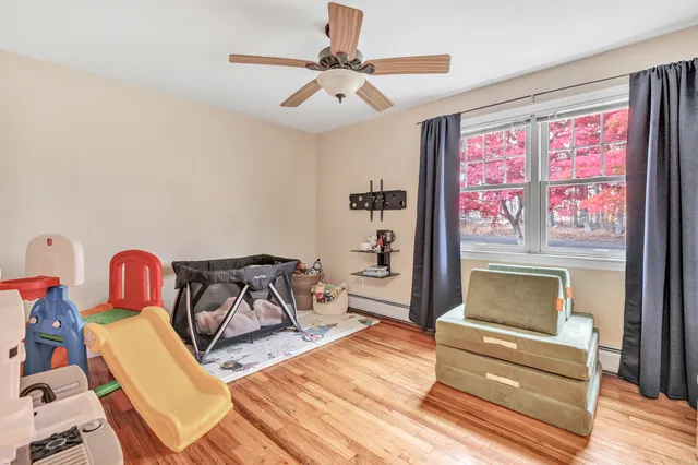 a bedroom with furniture and a window