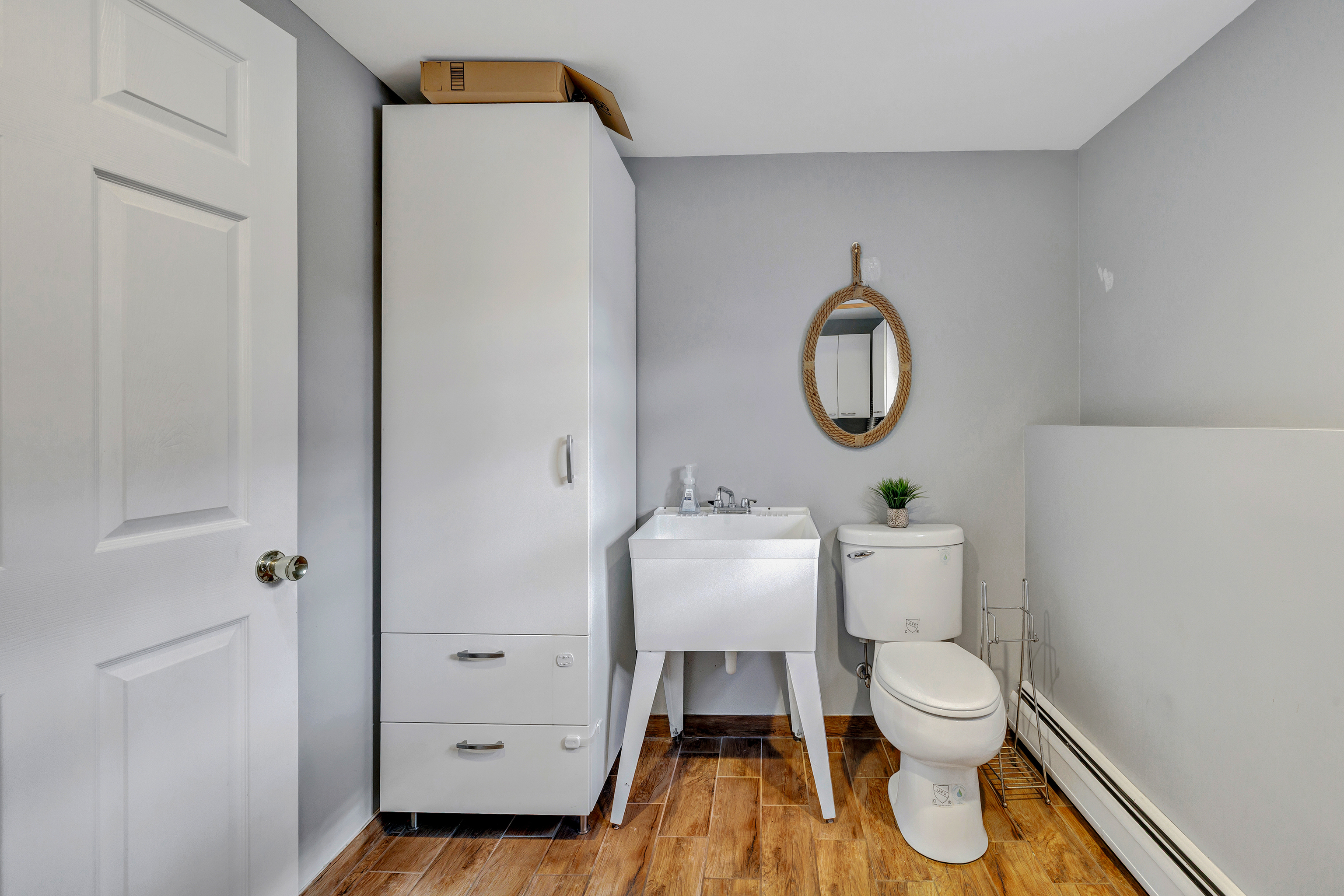 91 Harvester Road Monroe, CT 06468 - Photo 25 of 35 a white toilet sitting next to a bathroom sink