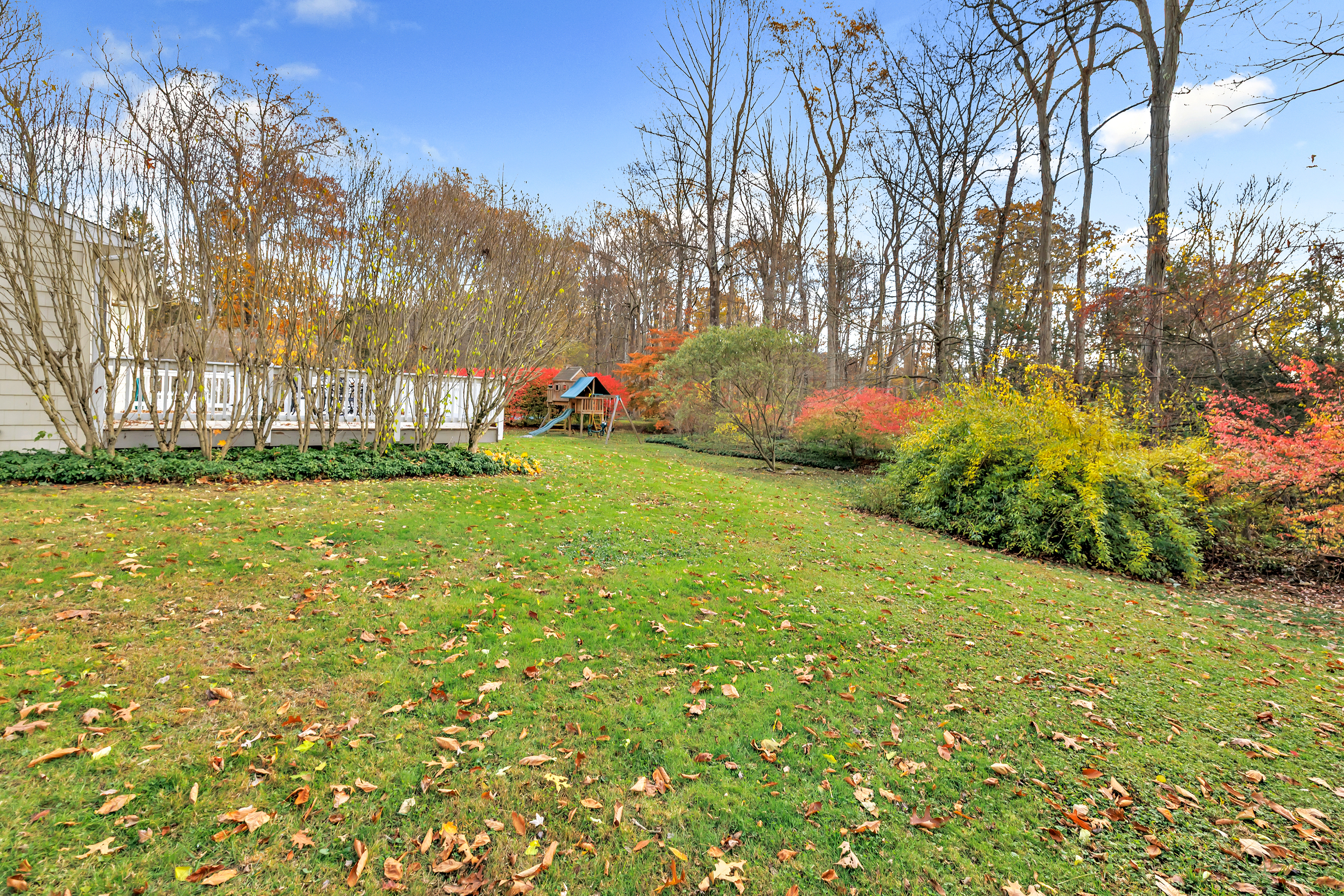 91 Harvester Road Monroe, CT 06468 - Photo 31 of 35 a view of a field of grass and trees