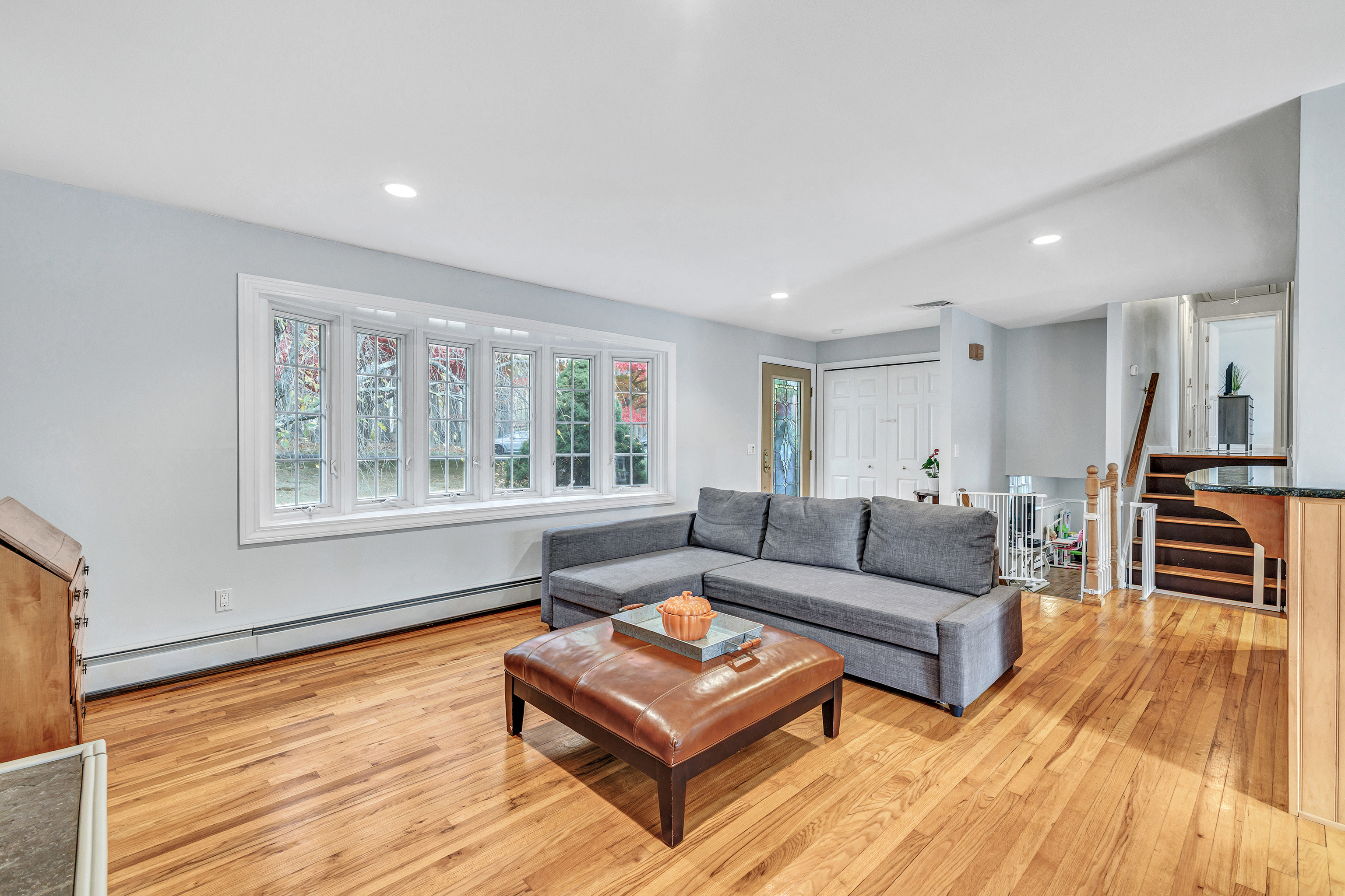 91 Harvester Road Monroe, CT 06468 - Photo 5 of 35 a living room with furniture and a wooden floor