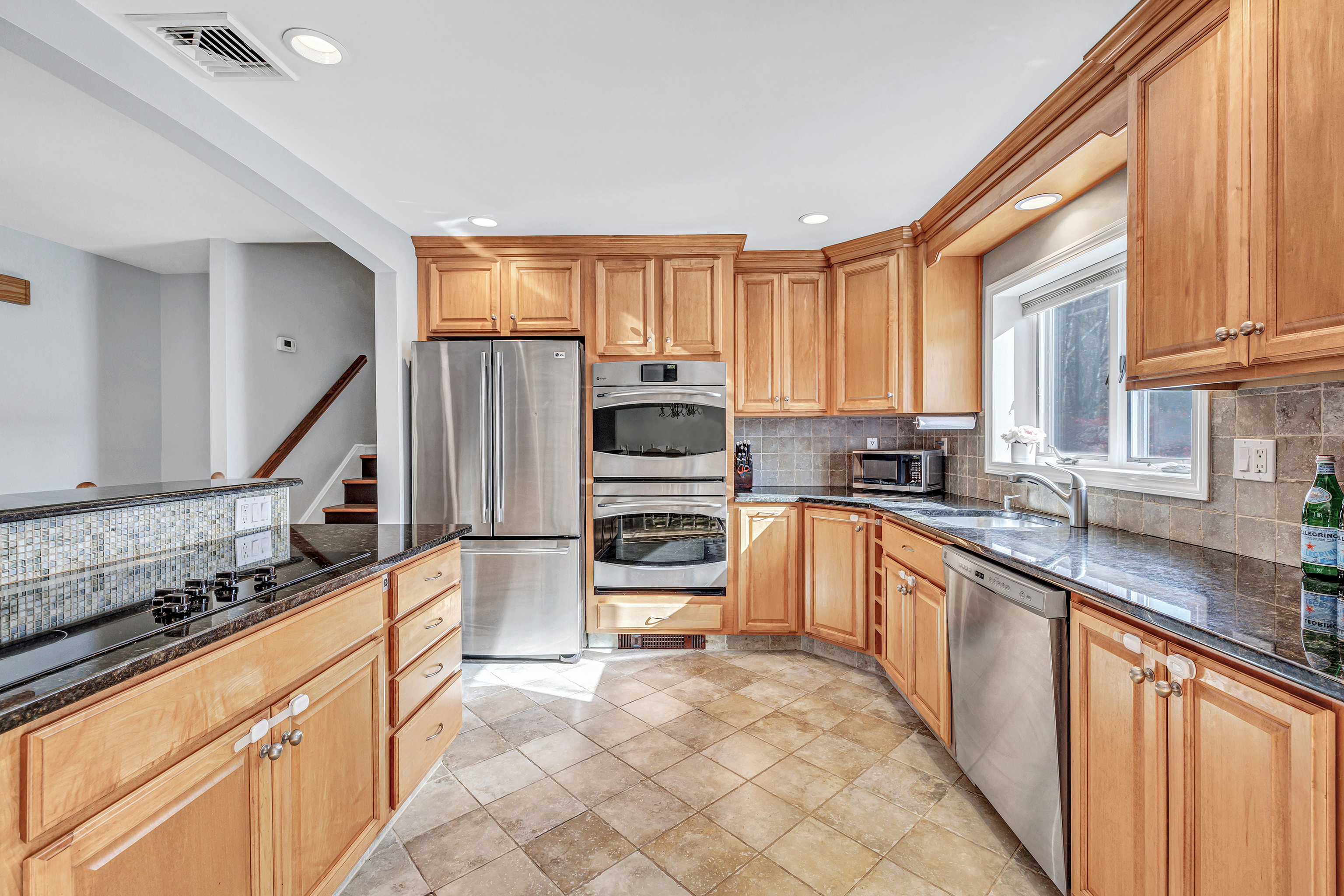 91 Harvester Road Monroe, CT 06468 - Photo 7 of 35 a kitchen with stainless steel appliances a stove sink and cabinets