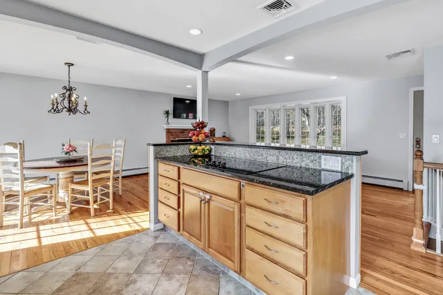 a kitchen with stainless steel appliances granite countertop a sink and cabinets