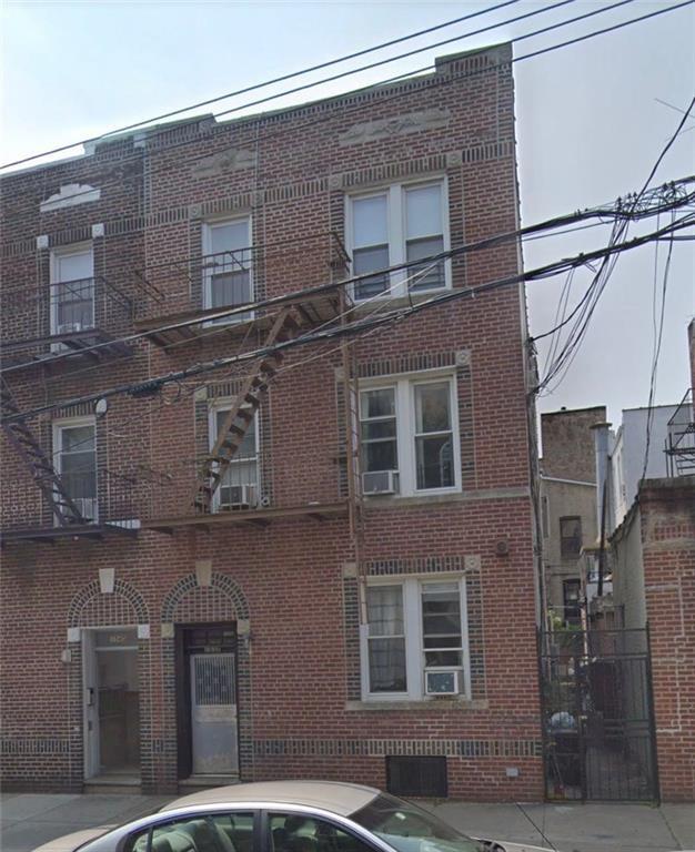 a front view of a building with a street