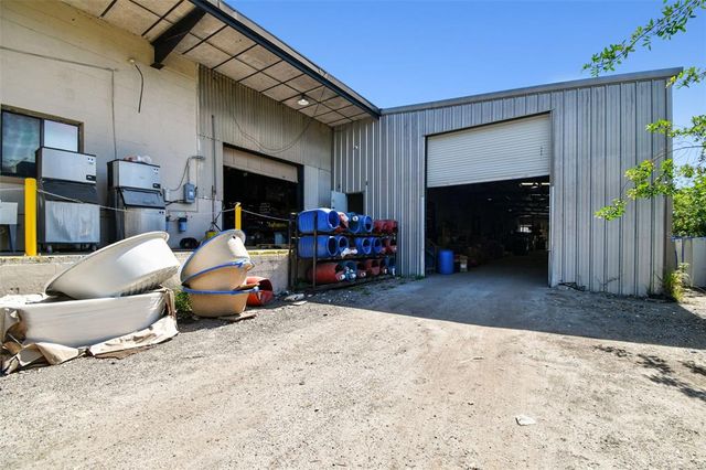 a view of a livingroom with workspace and a window