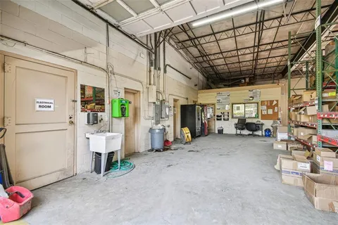 a view of empty room with wooden ceiling