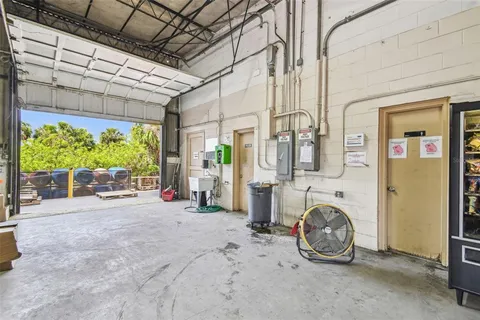 a bedroom with furniture and a flat screen tv