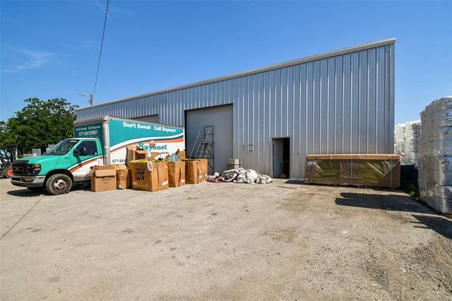 a view of a livingroom with furniture and a bathroom