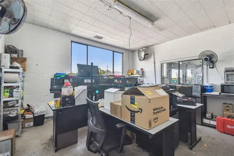 a reading room with furniture and window