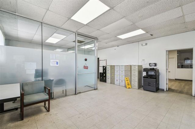 an aerial view of residential houses with outdoor space and street view