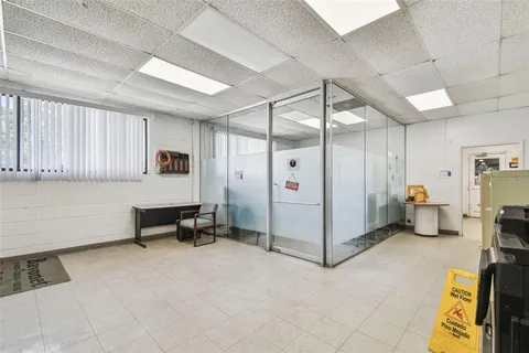 an aerial view of residential houses with outdoor space and parking