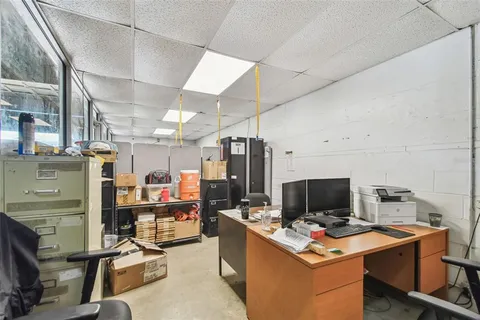 an aerial view of a house with swimming pool