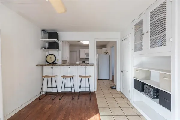 a view of kitchen with cabinets and wooden floor