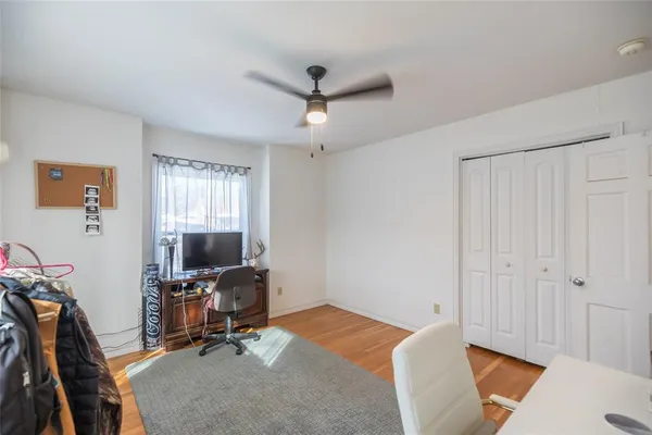 a bedroom with bed and gym equipment