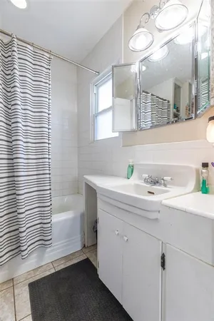 a bathroom with a bathtub and a sink