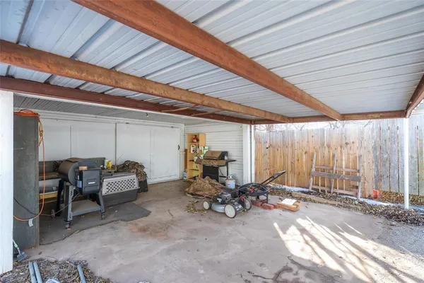 a view of a patio with table and chairs