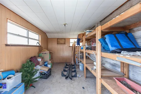 a storage room with lots of furniture and clutter