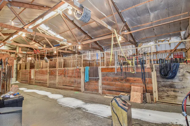 a kitchen with a sink cabinets stainless steel appliances and a large window