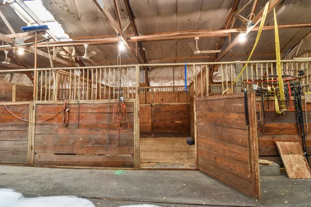 a bathroom with a sink a mirror and a shower