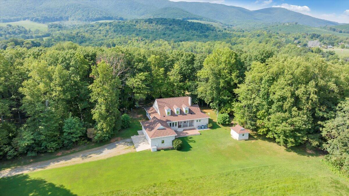 1056 Vfw Road Patrick Springs, VA 24133 - Photo 54 of 88 an aerial view of a house with yard and outdoor seating