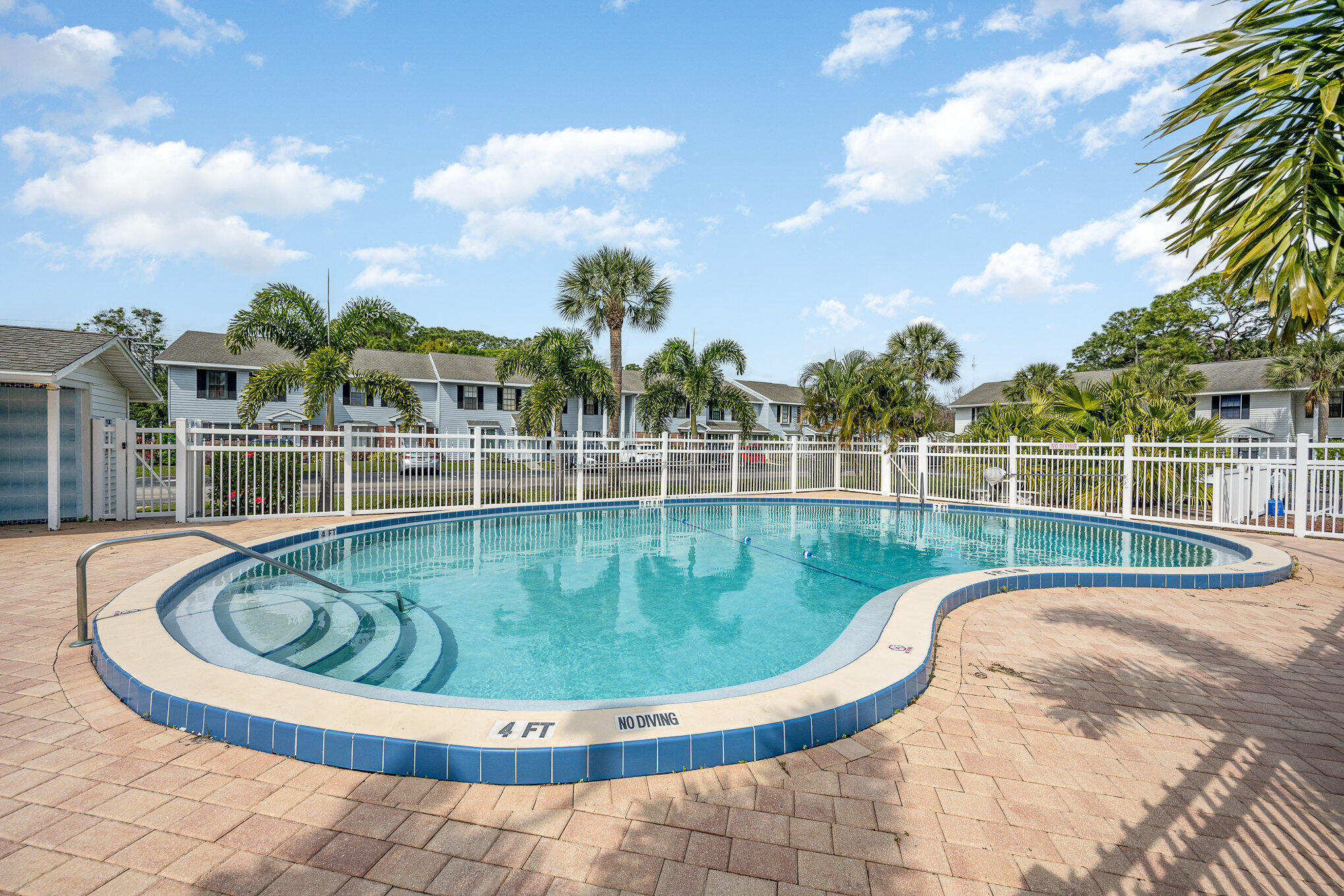 2114 Manor Drive Northeast Palm Bay, FL 32905 - Photo 22 of 24 a view of a swimming pool with a garden