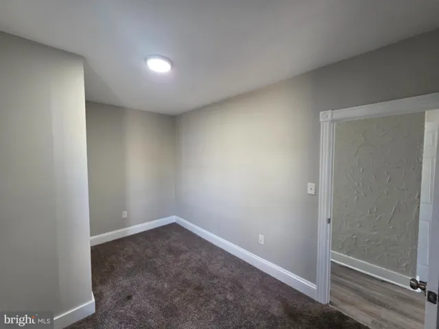 an empty room with sliding door