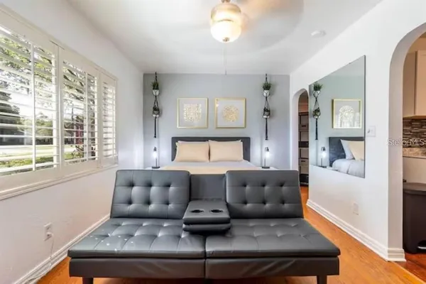 a living room with furniture and a large window