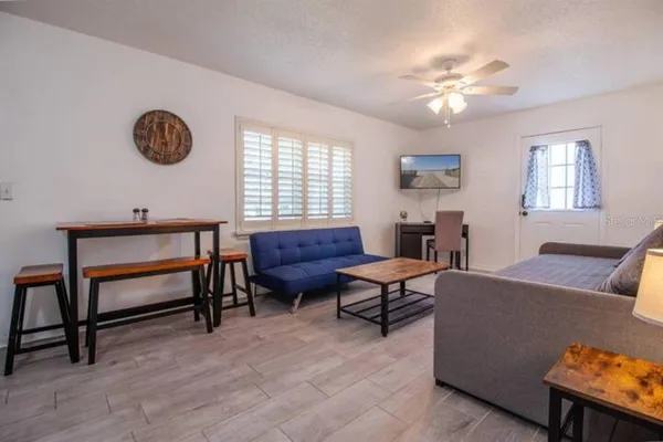 a living room with furniture and a window