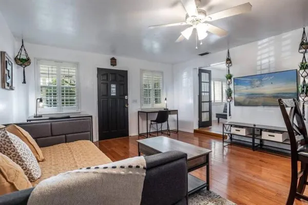 a living room with furniture and a window